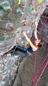 Jessy climbs the climbing wall