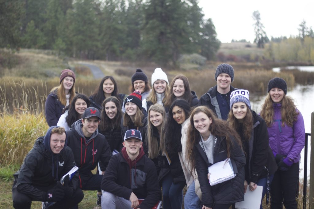 EPIC Group trip posing for a photo in the woods