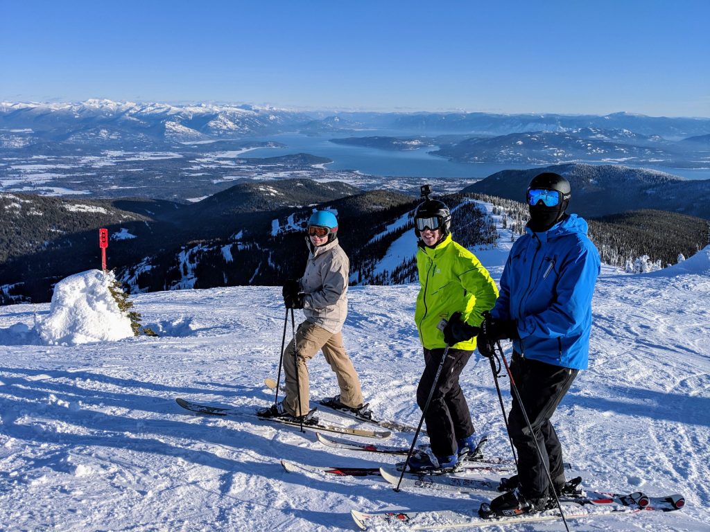 Skiiers skiing down a mountain