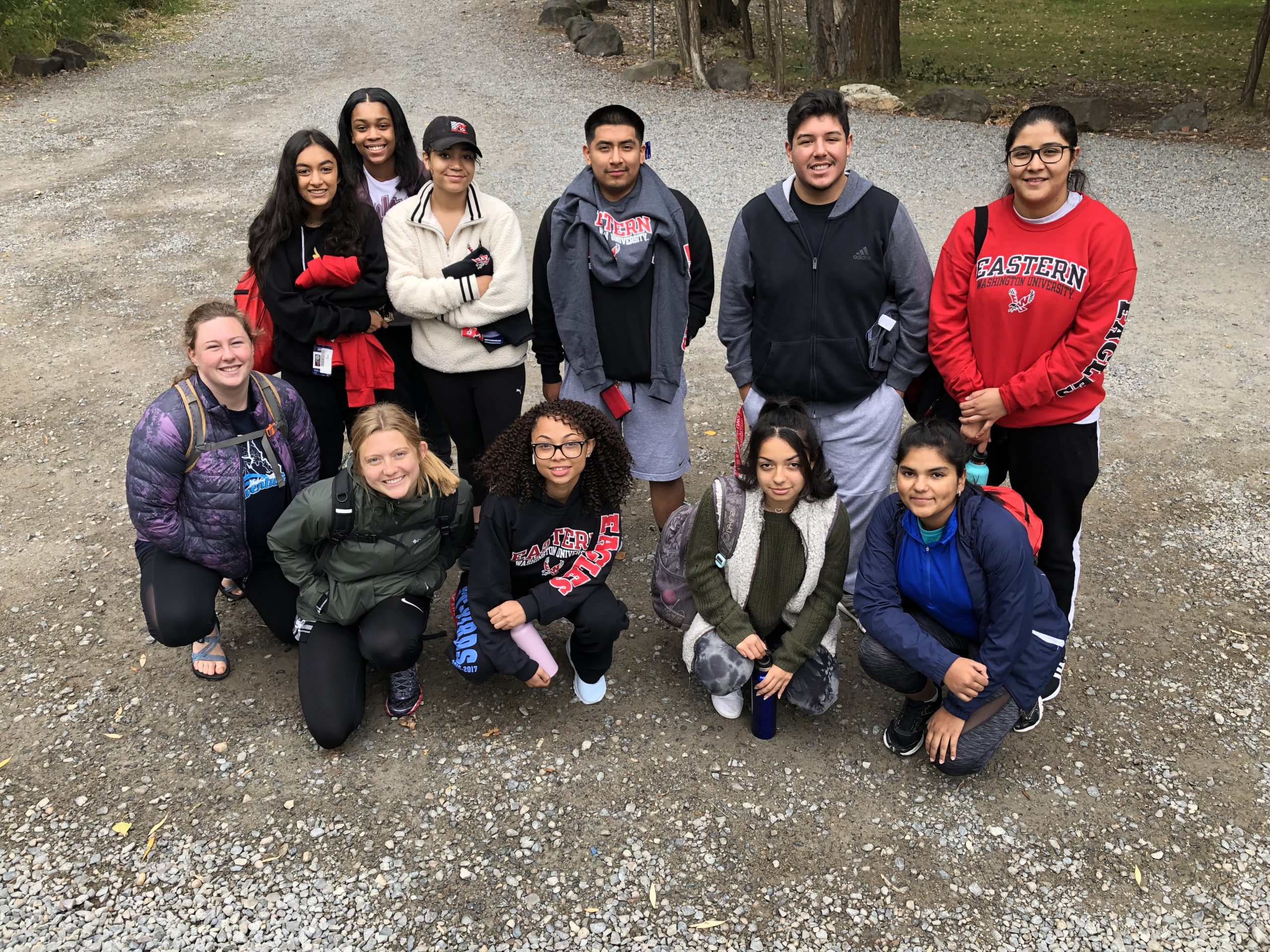 EPIC Group trip posing for a photo on a trail