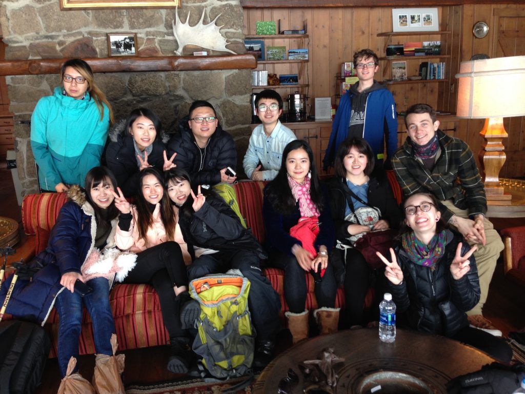 EPIC Group trip posing for a photo in a cabin