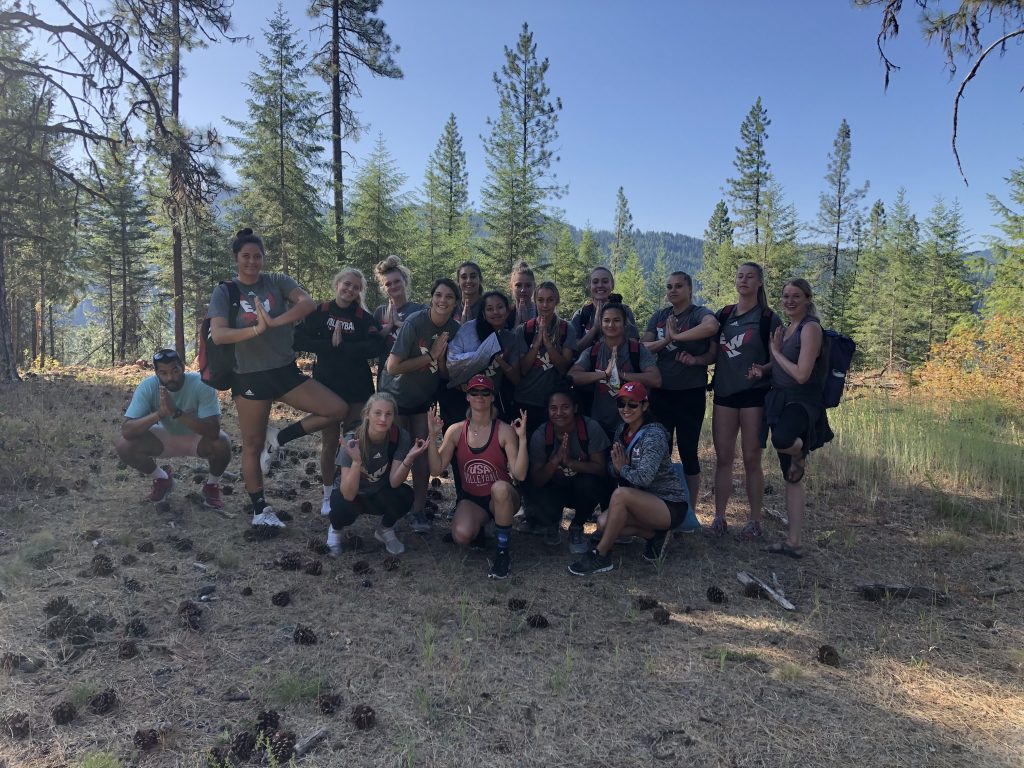 EPIC Group trip posing for a photo in the woods