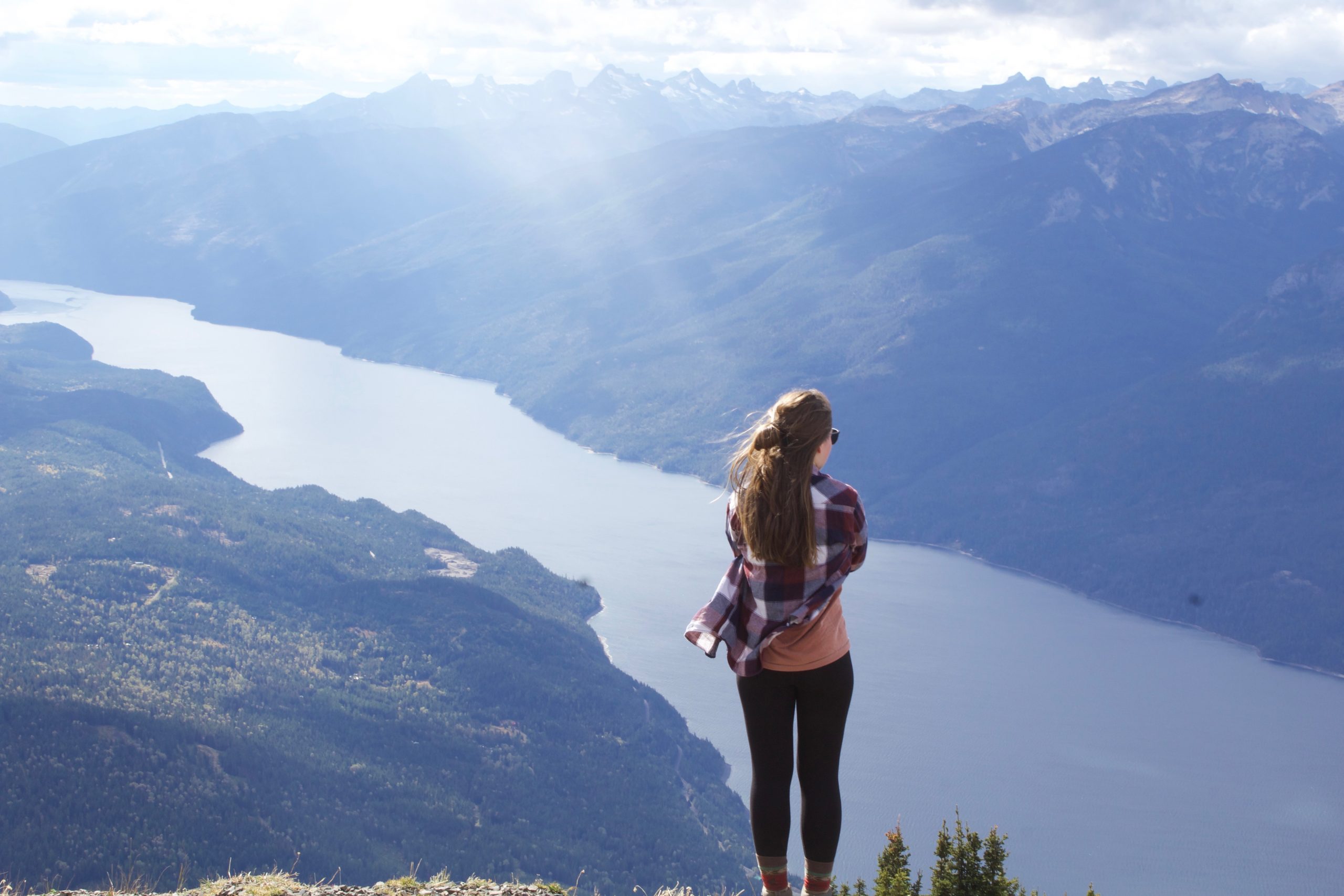 Woman standing on a mountain top