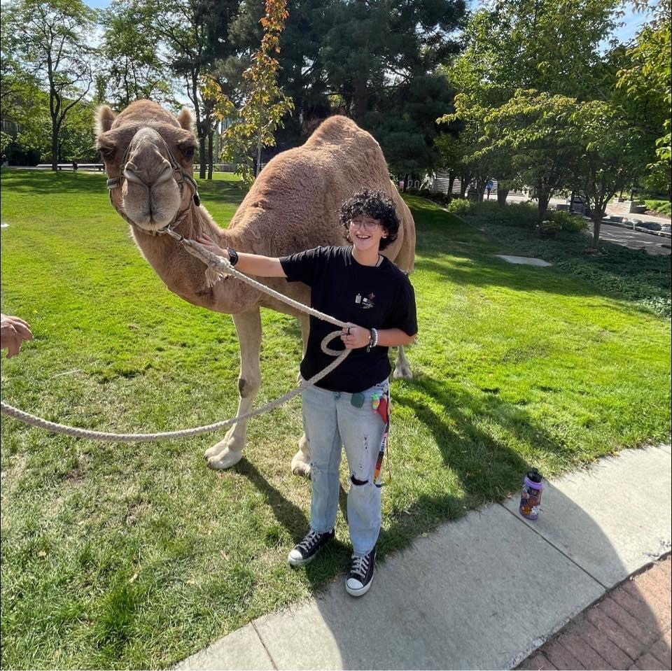 Charlie P. - Field Staff, walking a camel