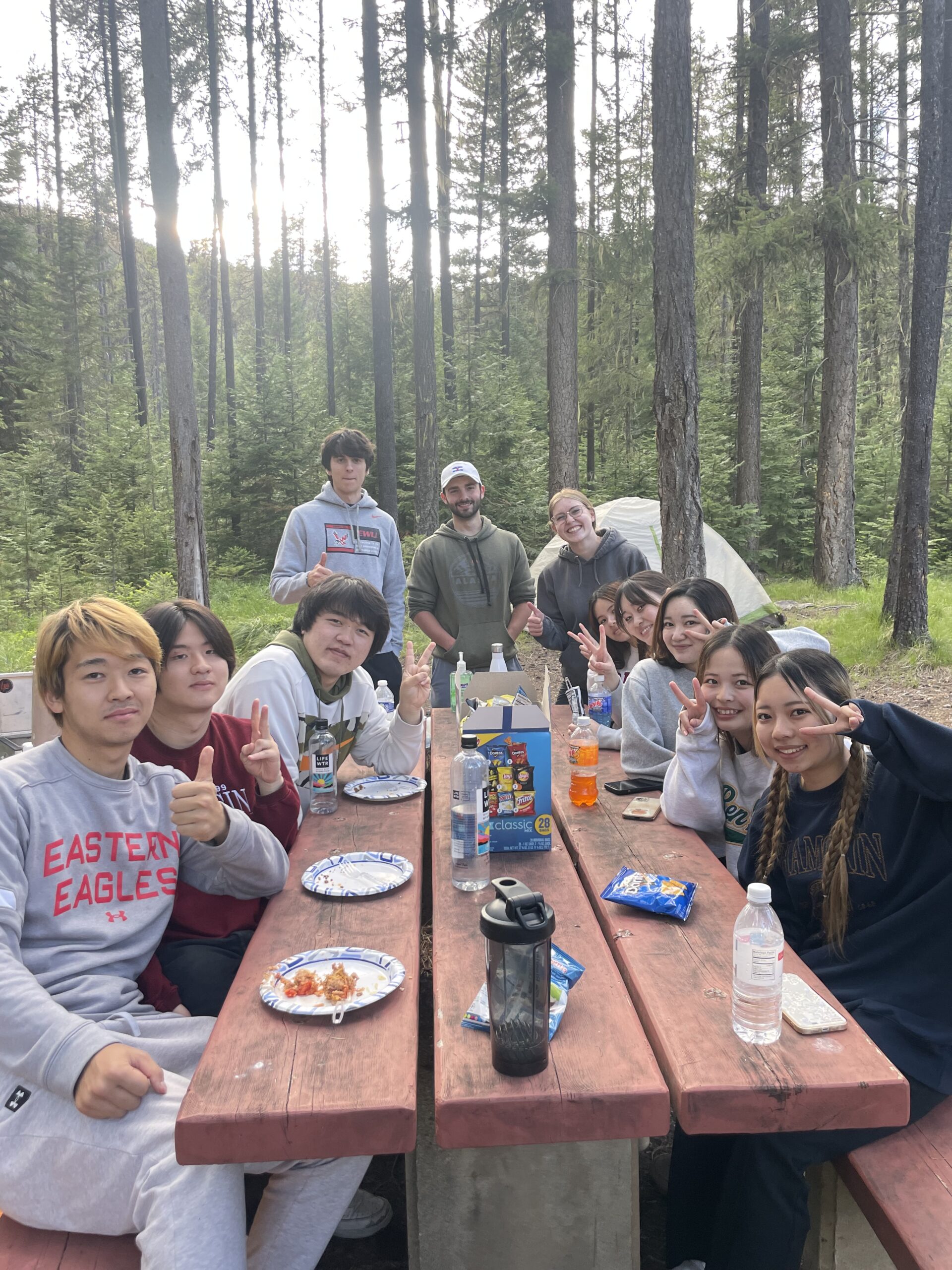 People enjoying lunch while camping