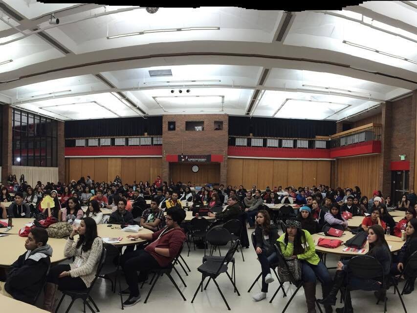 photo of people at the Izkalli Calmecac student conference. The photo is a wide angle showing a view of all the students