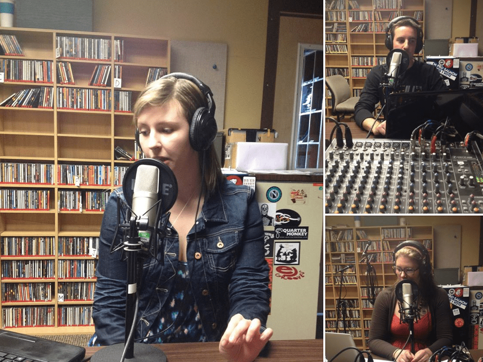 three people discussing issues. They are in a radio room all with headphones and mics by them