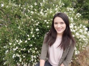 photo of Andrea Diaz with forest background