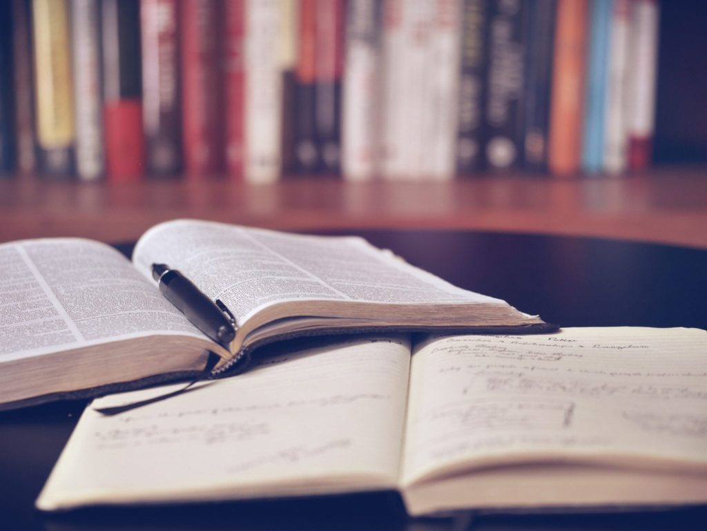 Books near a bookshelf