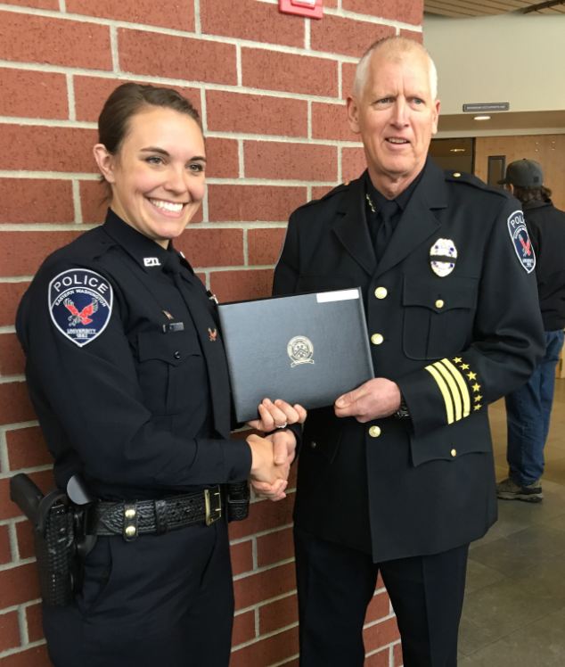 Officer Fell, graduating from the academy, with Chief Walters