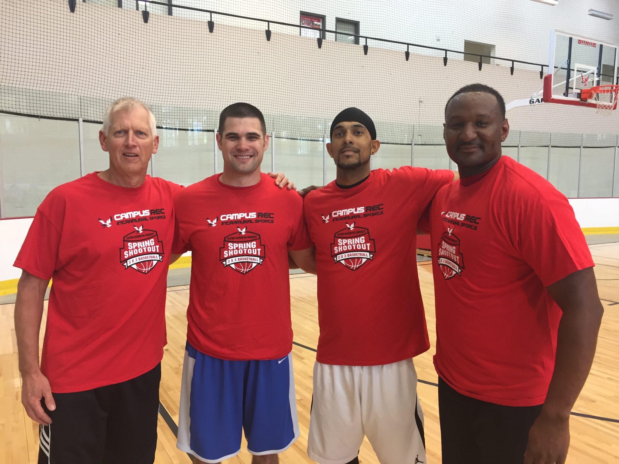 Officers participating in 3 on 3 basketball