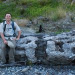 A man siting on a log