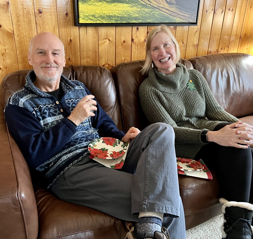 Two people sitting, smiling