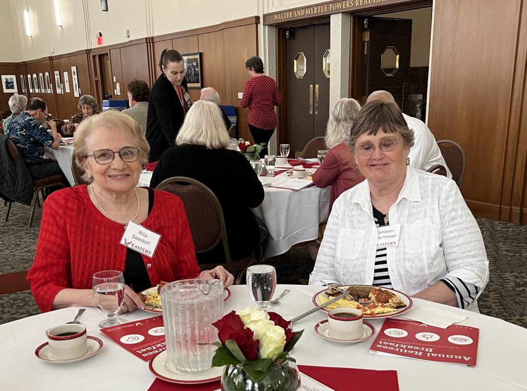 Two seated people at a breakfast