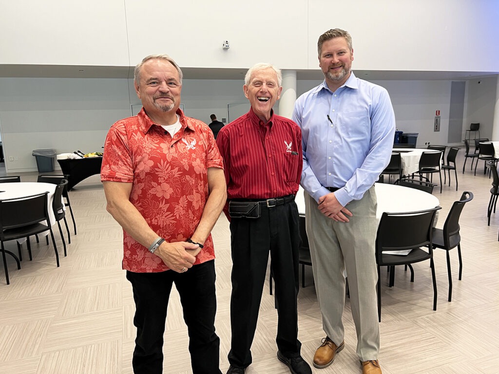 Three other people standing together for a photo