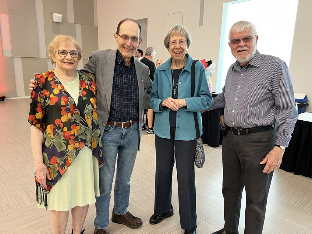 A photo of four people together