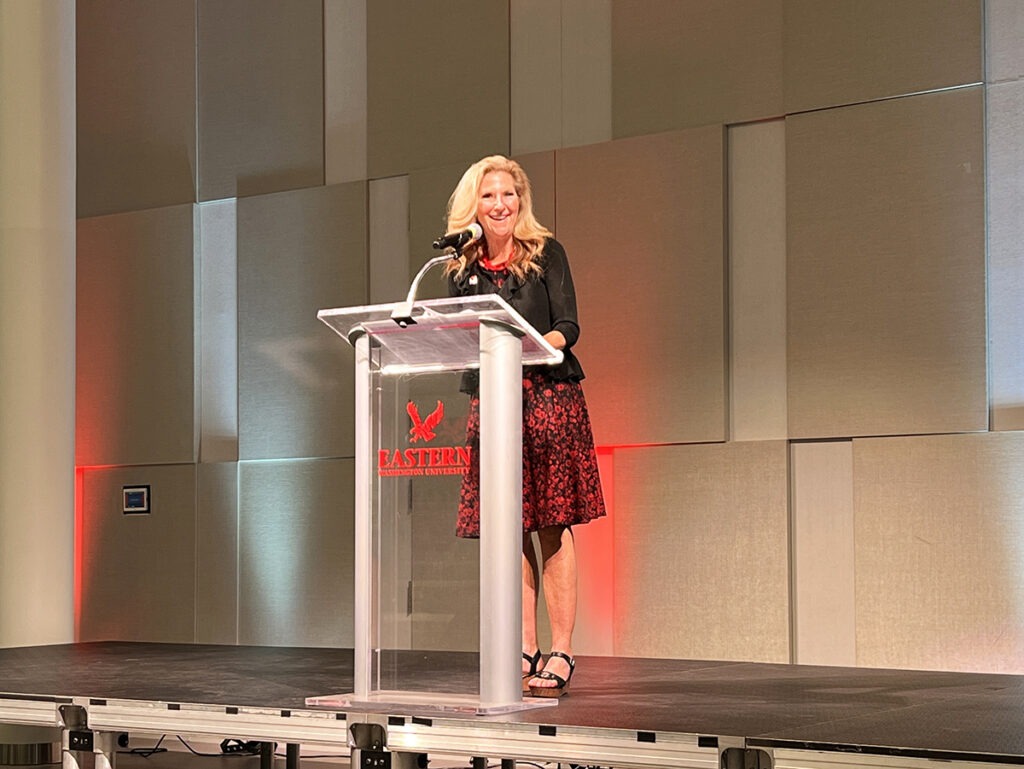 A woman behind a podium