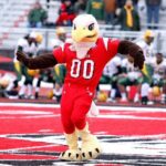 A photo of EWU's mascot, Swoop, dancing for crowd at the big red Roos Field.