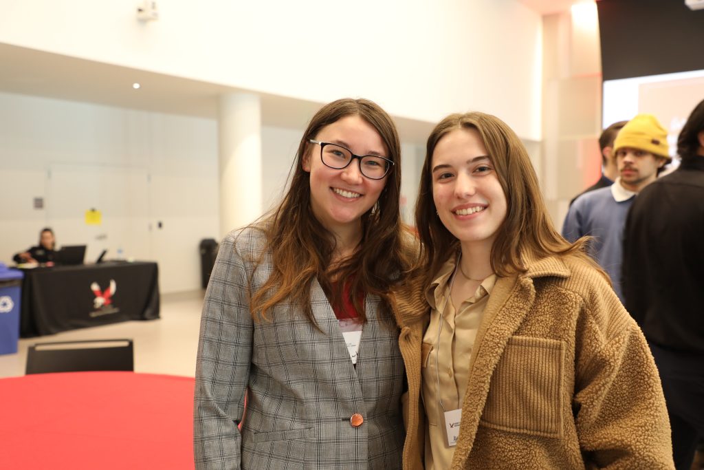 Photo to two women together smiling in the Nysether Community Room